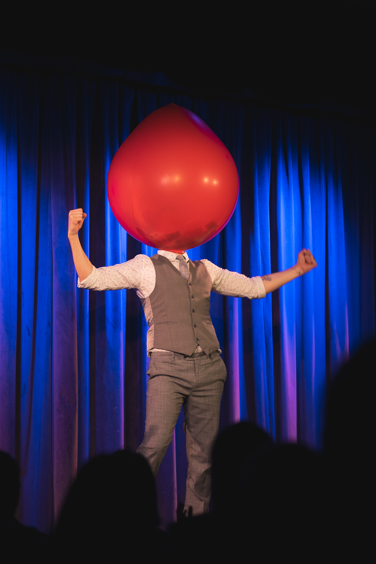 Nick Paul performing for a seated evening audience